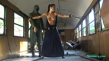 Play Bdsm model Alex Zothberg nude, oiled, captive and whipped in train